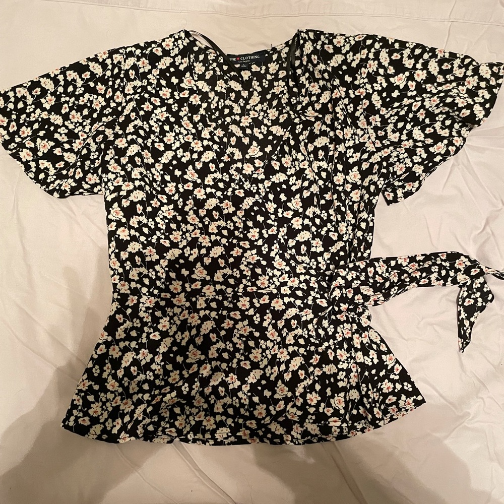 Black wrap top with white and red flowers